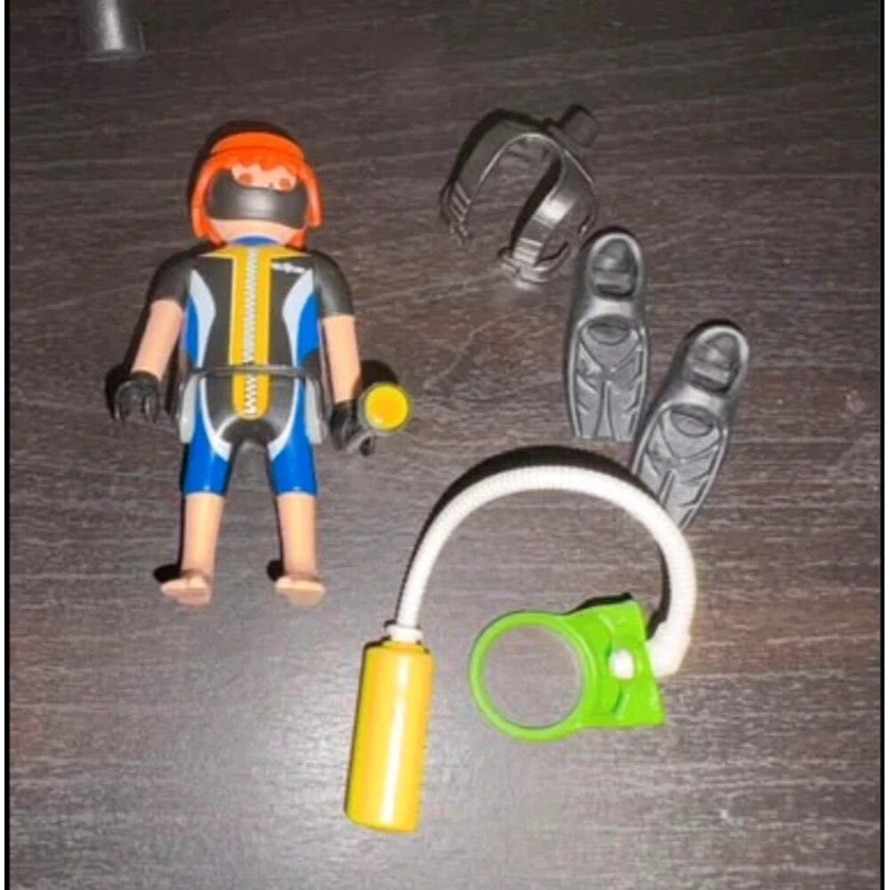 Playmobil scuba diver figure with various accessories